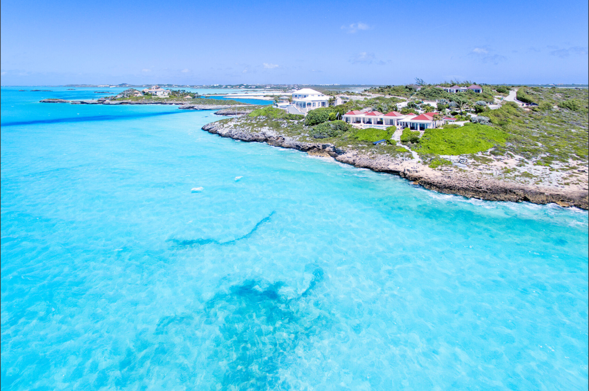 Aerial view of the turquoise shoreline in Providenciales, Turks and Caicos